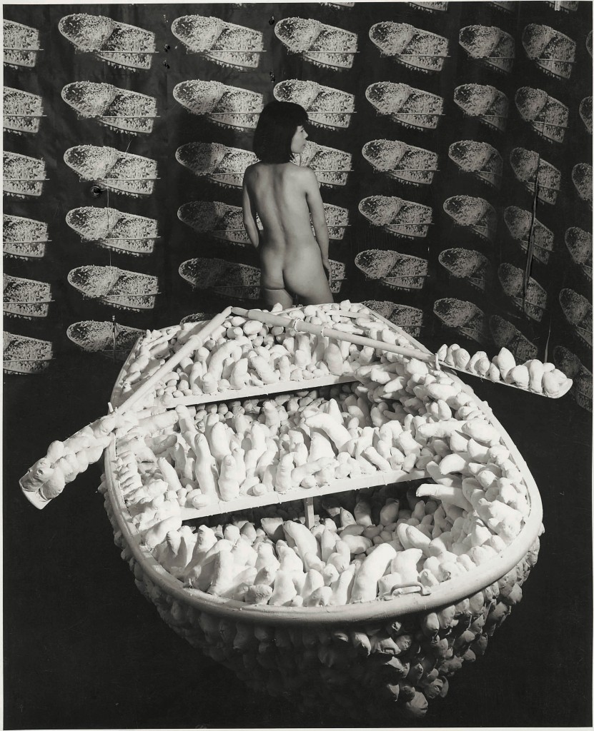Kusama posing in Aggregation - One Thousand Boats Show 1963 installation view - Gertrude Stein Gallery - New York 1963