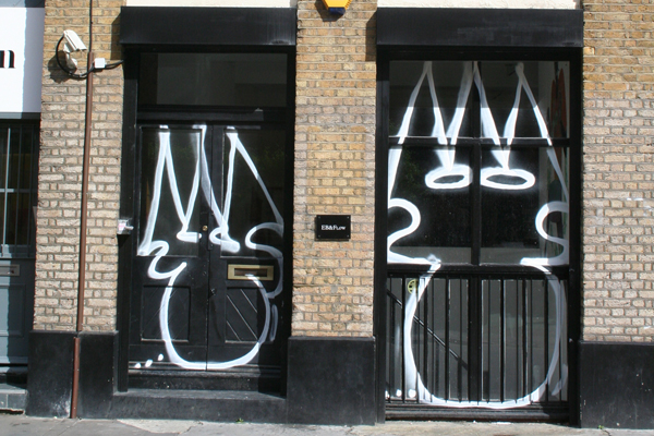 Tek 33, The gallery are a bit pissed off that you tagged the front door. Spray paint on wood and glass. Courtesy the Artist and EB&Flow