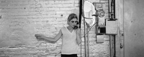 Stephen Shore. Edie Sedgwick using the only phone at The Factory, NYC, ca. 1965-1967.